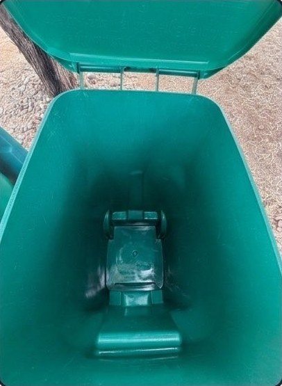 The same trash bin scrubbed clean and sanitized